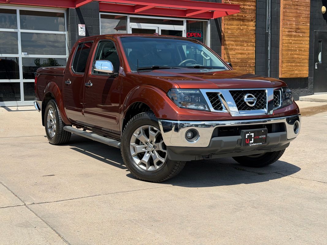 Orange 2016 Nissan Frontier Pickup Truck Four-Wheel Drive 5-Speed Automatic