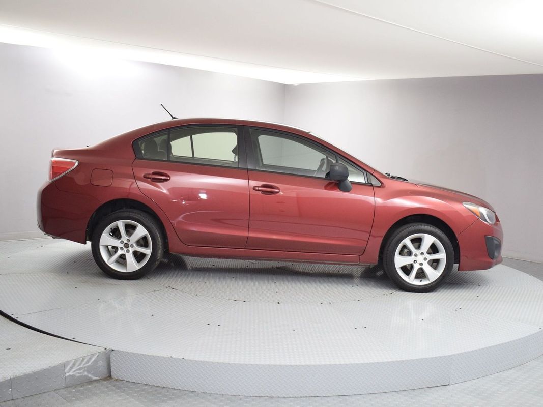 Red 2014 Subaru Impreza Sedan All-Wheel Drive 5-Speed Manual