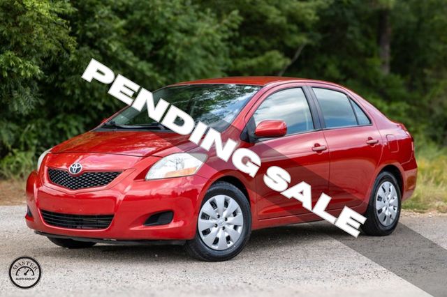 Red 2010 Toyota Yaris Sedan Front-Wheel Drive 4-Speed Automatic