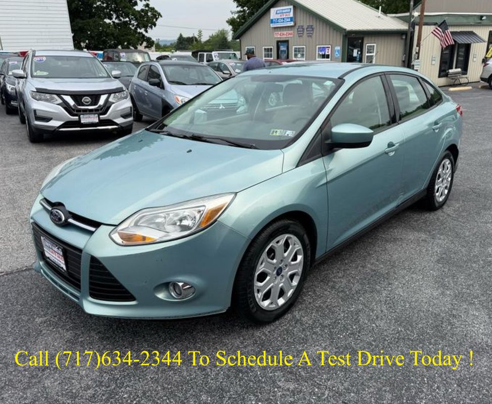 Off-white 2012 Ford Focus Sedan Front-Wheel Drive 6-Speed Automatic