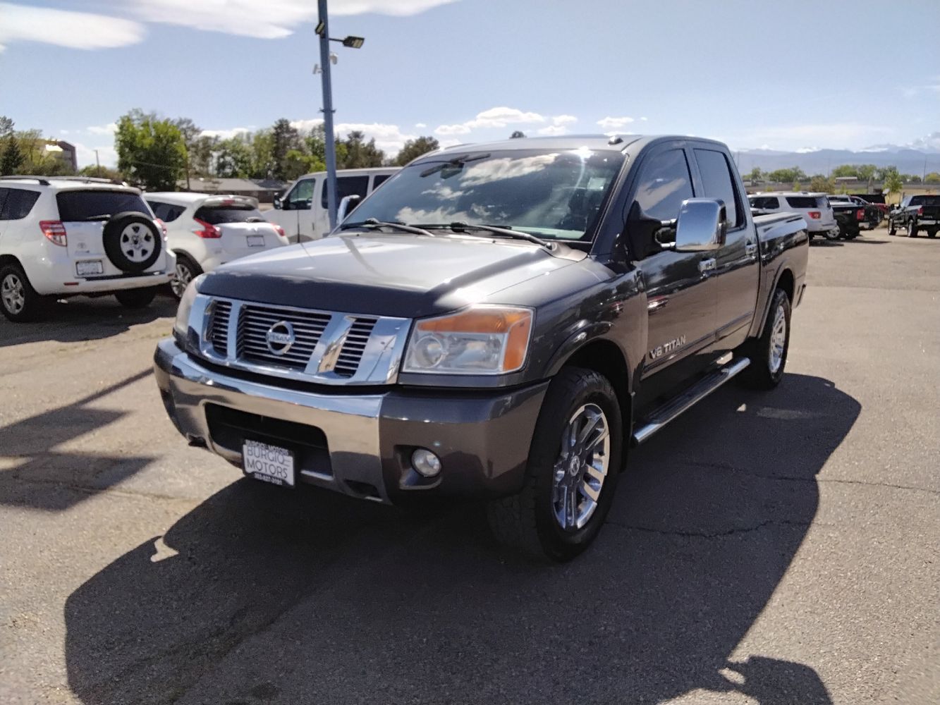 2010 Nissan Titan LE 4X4 Crew Cab SWB's photo