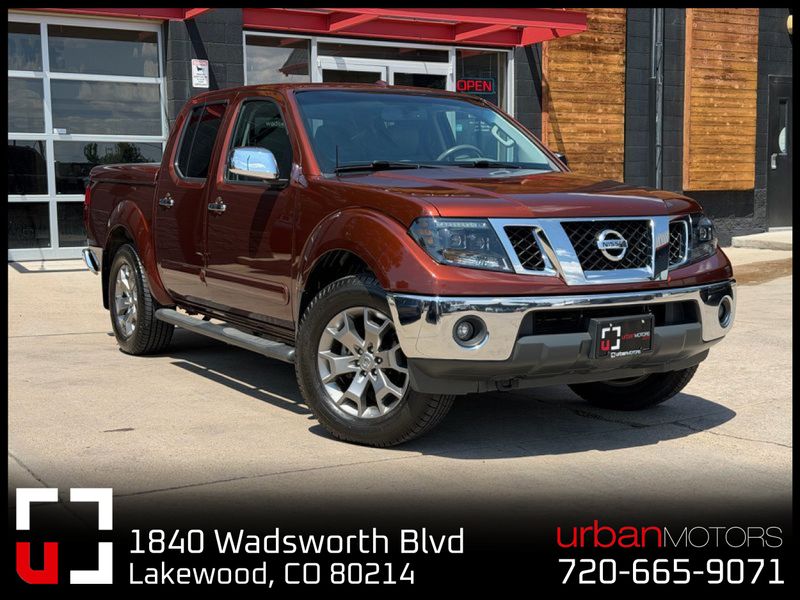 Orange 2016 Nissan Frontier Pickup Truck Four-Wheel Drive 5-Speed Automatic