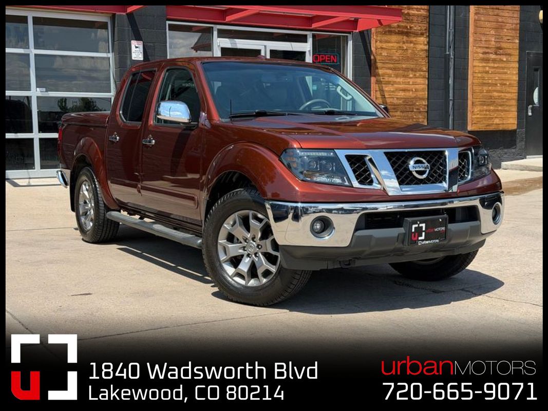 Orange 2016 Nissan Frontier Pickup Truck Four-Wheel Drive 5-Speed Automatic